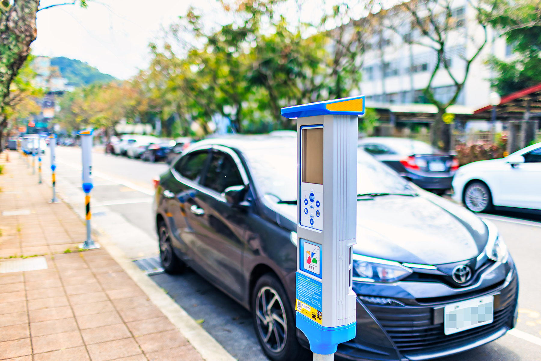 Smart parking meter + car front angle